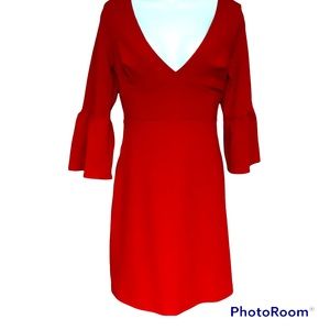 ANel limited edition red dress. Low back with tie. Long  bell sleeves.